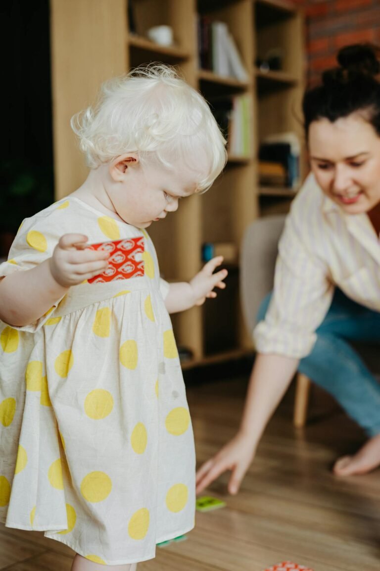 Mother and child enjoying playtime with a puzzle indoors.